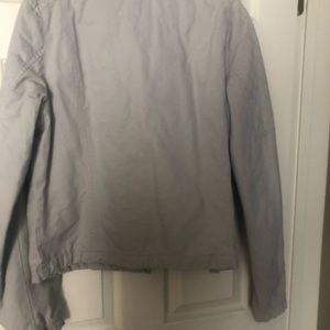 Light grey moto style jacket.